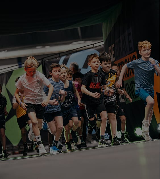 Young athletes training with HYROX equipment